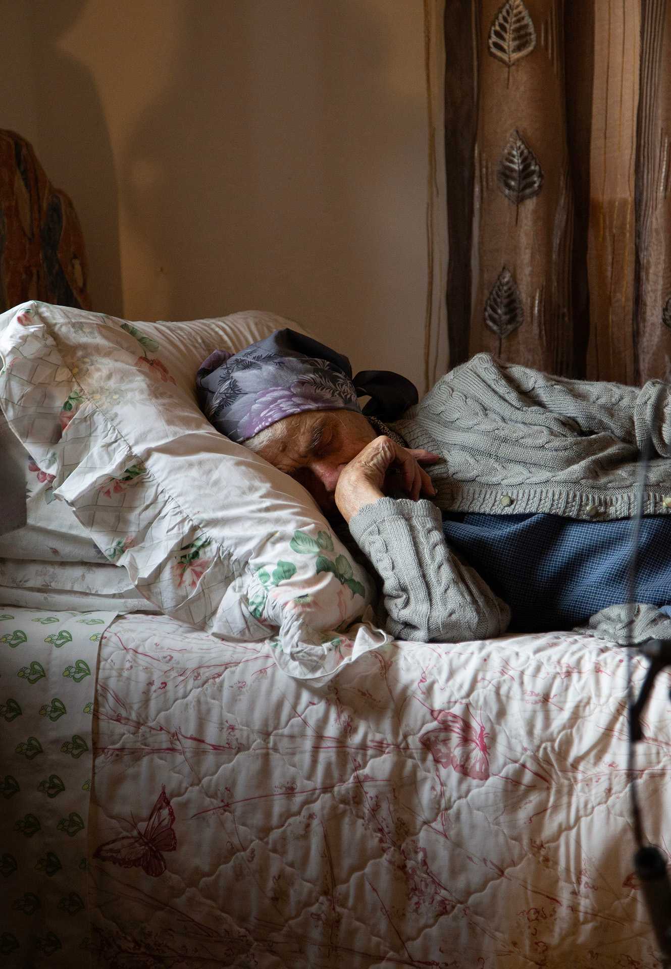 Great grandmother laying in bed